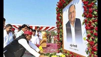 Samajwadi Party president Akhilesh Yadav pays tribute to his father and former union minister Mulayam Singh Yadav on his death anniversary, at Saifai village in Etawah district, Friday. (PTI Photo)