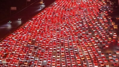 China’s 36-lane highway jammed as millions returned from holiday, leaving endless queues at Wuzhuang toll station. (AFP) China’s 36-lane highway jammed as millions returned from holiday, leaving endless queues at Wuzhuang toll station. (AFP)