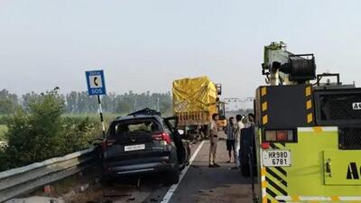 The car that crashed into a truck parked on the national highway near Mehan in Rohtak district on Friday. Three people were killed on the spot. (HT Photo)