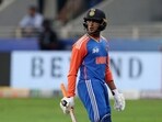 Abhishek Sharma walks after losing his wicket.