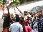 Police used water cannons to disperse BJP activists protesting over the alleged reduction in weight of gold-clad plates of the Dwarapalaka guardian deity, idols at the Sabarimala Temple, in Kochi, Kerala, on October 9, 2025.