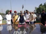 Punjab governor Gulab Chand Kataria, accompanied by his wife Anita Kataria, pays tributes to Shaheed Bhagat Singh and other martyrs (HT Photo) Punjab governor Gulab Chand Kataria, accompanied by his wife Anita Kataria, pays tributes to Shaheed Bhagat Singh and other martyrs (HT Photo)