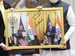 The framed photo that Sergio Gor presented to PM Narendra Modi with President Donald Trump and his message also in it, on Saturday, October 11. 