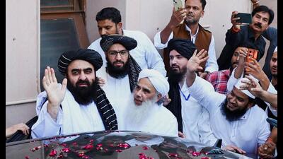 Amir Khan Muttaqi arrives at Darul Uloom Deoband on Saturday. (REUTERS)