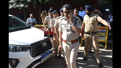 CChandigarh DGP Sagar Preet Hooda arrives at residence of Haryana IPS officer Y Puran Kumar on Saturday. (Sanjeev Sharma/Hindustan Times)
