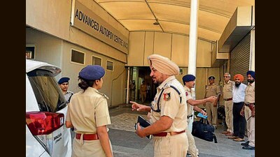 Chandigarh senior superintendent of police Kanwardeep Kaur and a SIT member outside the PGIMER autopsy centre on Saturday (HT Photo) Chandigarh senior superintendent of police Kanwardeep Kaur and a SIT member outside the PGIMER autopsy centre on Saturday (HT Photo)