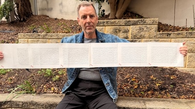 The man with the longest name in the world holding up a document that shows his entire name. (Guinness World Records) The man with the longest name in the world holding up a document that shows his entire name. (Guinness World Records)