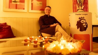 English footballer Michael Owen posing alongside diyas ahead of Diwali