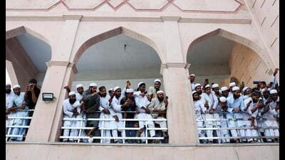 People take pictures on their mobile phones as Taliban foreign minister Amir Khan Muttaqi arrives at Darul Uloom Deoband. (REUTERS) People take pictures on their mobile phones as Taliban foreign minister Amir Khan Muttaqi arrives at Darul Uloom Deoband. (REUTERS)