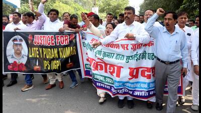 Representatives of various organisations protest the suicide of IPS officer Y Puran Kumar and throwing of shoe at Chief Justice of India in Rohtak on Saturday. (Manoj Dhaka/HindustanTimes) Representatives of various organisations protest the suicide of IPS officer Y Puran Kumar and throwing of shoe at Chief Justice of India in Rohtak on Saturday. (Manoj Dhaka/HindustanTimes)