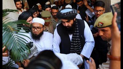 Taliban foreign minister Amir Khan Muttaqi exits a room at a guest house near the Darul Uloom Deoband on Saturday. (REUTERS) Taliban foreign minister Amir Khan Muttaqi exits a room at a guest house near the Darul Uloom Deoband on Saturday. (REUTERS)