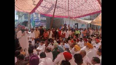 The legal action came after villagers and leaders from across political parties staged a day-long protest outside the Jalalabad police station in Fazilka district. (HT) The legal action came after villagers and leaders from across political parties staged a day-long protest outside the Jalalabad police station in Fazilka district. (HT)