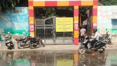 There is a school nearby, and students often have to cross roads flooded with sewage water, said residents. (HT) There is a school nearby, and students often have to cross roads flooded with sewage water, said residents. (HT)