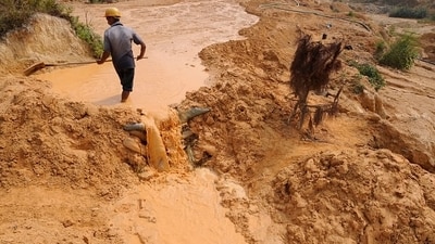A laborer works at the site of a rare-earth metals mine in Jiangxi province, China. (WSJ) A laborer works at the site of a rare-earth metals mine in Jiangxi province, China. (WSJ)