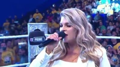 WWE's Crown Jewel event in Perth saw Australian singer Sophie Foster jeered while performing the US national anthem. (X@ShootOrWork) WWE's Crown Jewel event in Perth saw Australian singer Sophie Foster jeered while performing the US national anthem. (X@ShootOrWork)