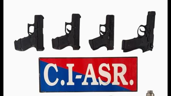 The recovered weapons include three 9mm pistols and five .30 bore pistols, along with magazines (HT Photo)