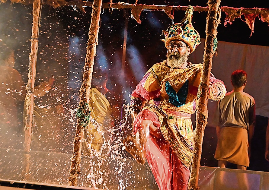 The theatrical character of the king (played by Albert Maliyekkal) performs to exhaustion on the inundated stage. The theatrical character of the king (played by Albert Maliyekkal) performs to exhaustion on the inundated stage.