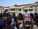 Protesters gather around a Madagascar military vehicle during a nationwide youth-led protest over frequent power outages and water shortages, 