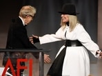  Filmmaker Woody Allen, left, greets actress Diane Keaton onstage to present her with the 45th AFI Life Achievement Award on June 8, 2017, in Los Angeles. 