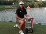 Singapore’s Shannon Tan poses with the trophy after winning the Hero Women’s Indian Open 2025 at the DLF Golf and Country Club course in Gurgaon on Sunday. (HT Photo)