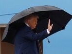 President Donald Trump waves from the stairs of Air Force One on Sunday, October 12, 2025, as he travels to the Middle East.
