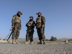 Taliban security personnel stand guard along a road in the Zazai Maidan district of Khost province near the Afghanistan-Pakistan border on October 12, 2025. Taliban security personnel stand guard along a road in the Zazai Maidan district of Khost province near the Afghanistan-Pakistan border on October 12, 2025.