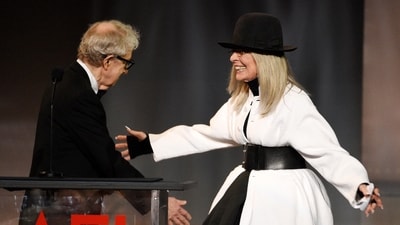Filmmaker Woody Allen, left, greets actress Diane Keaton onstage to present her with the 45th AFI Life Achievement Award on June 8, 2017, in Los Angeles. (Chris Pizzello/Invision/AP)