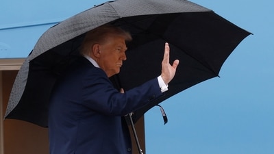 President Donald Trump waves from the stairs of Air Force One on Sunday, October 12, 2025, as he travels to the Middle East. (AP) President Donald Trump waves from the stairs of Air Force One on Sunday, October 12, 2025, as he travels to the Middle East. (AP)