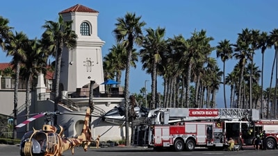 Five injured after helicopter crashes near Huntington Beach ahead of 'Cars and Copters' show. (Getty Images via AFP) Five injured after helicopter crashes near Huntington Beach ahead of 'Cars and Copters' show. (Getty Images via AFP)