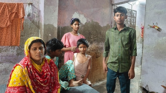 Family members of Sher Singh, a sanitation worker in their residence in New Delhi.(PTI)