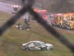This image made from video provided by WCVB-TV, shows the scene after a small plane crashed onto a highway in Dartmouth, Mass., Monday Oct. 13.