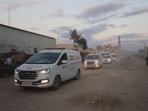 Palestinian Red Crescent ambulances move towards the eastern Gaza Strip from Khan Yunis as Israel and Hamas begin their hostage release Palestinian Red Crescent ambulances move towards the eastern Gaza Strip from Khan Yunis as Israel and Hamas begin their hostage release