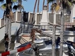 HUNTINGTON BEACH, CALIFORNIA - OCTOBER 11: The wreckage of a helicopter that crashed is seen on Pacific Coast Highway on October 11, 2025 in Huntington Beach, California. Five people were reportedly onboard and transported to a local hospital.   Michael Heiman/Getty Images/AFP (Photo by Michael HEIMAN / GETTY IMAGES NORTH AMERICA / Getty Images via AFP)
