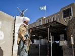 An Armed Taliban security personnel keeps guard beside the closed gate of the zero point border crossing between Afghanistan and Pakistan at Spin Boldak district in Kandahar An Armed Taliban security personnel keeps guard beside the closed gate of the zero point border crossing between Afghanistan and Pakistan at Spin Boldak district in Kandahar