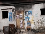 The home of hostage David Cunio in Nir Oz. Posters show him and family members. The home of hostage David Cunio in Nir Oz. Posters show him and family members.