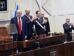 President Donald Trump arrives with Knesset Speaker Amir Ohana and Israel's President Isaac Herzog to speak to the Knesset, Israel's parliament, Monday, Oct. 13, 2025, in Jerusalem. President Donald Trump arrives with Knesset Speaker Amir Ohana and Israel's President Isaac Herzog to speak to the Knesset, Israel's parliament, Monday, Oct. 13, 2025, in Jerusalem.