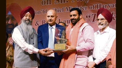 (From left) Global Punjabi Association chief patron and author of ‘Tilak Janju Ka Rakha’ Iqbal Singh Lalpura, association president Kulwant Singh Dhaliwal, Haryana CM Nayab Singh Saini and former Punjab Agricultural University VC Kirpal Singh Aulakh at Tagore Theatre, Sector 18, Chandigarh, on Monday. (Keshav Singh/HT) (From left) Global Punjabi Association chief patron and author of ‘Tilak Janju Ka Rakha’ Iqbal Singh Lalpura, association president Kulwant Singh Dhaliwal, Haryana CM Nayab Singh Saini and former Punjab Agricultural University VC Kirpal Singh Aulakh at Tagore Theatre, Sector 18, Chandigarh, on Monday. (Keshav Singh/HT)