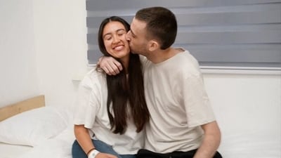 Released Israeli hostage, Avinatan Or, held in Gaza since the deadly October 7, 2023 attack by Hamas, kisses his girlfriend, Noa Argamani, who was also taken hostage and rescued in 2024, after his release as part of a prisoner-hostage swap. (via REUTERS)