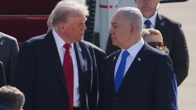 President Donald Trump, center, talks with Israel's Prime Minister Benjamin Netanyahu as he arrives at Ben Gurion Airport near Tel Aviv, Israel, Monday, Oct. 13, 2025. (AP) President Donald Trump, center, talks with Israel's Prime Minister Benjamin Netanyahu as he arrives at Ben Gurion Airport near Tel Aviv, Israel, Monday, Oct. 13, 2025. (AP)