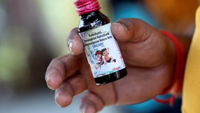 Nilesh Suryavanshi, 32, the father of a 3 year old child who has been admitted at the Government Medical College, holds a bottle of Coldrif cough syrup, which has been linked to the deaths of 17 children, in Nagpur, India, October 8, 2025. (REUTERS)