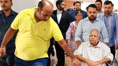 RJD chief Lalu Prasad Yadav, his wife Rabri Devi, and son Tejashwi Yadav at Rouse Avenue Court for a hearing on charges in the IRCTC scam case, in New Delhi on Monday. (PTI) RJD chief Lalu Prasad Yadav, his wife Rabri Devi, and son Tejashwi Yadav at Rouse Avenue Court for a hearing on charges in the IRCTC scam case, in New Delhi on Monday. (PTI)