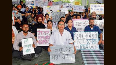 Students protesting at GADVASU in Ludhiana on Monday. (HT Photo)