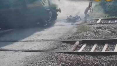 The victim was returning home when he attempted to cross the Boraki railway crossing from under the closed barrier, officials said. “As he came on the track, he suddenly applied brakes on spotting a train and tripped,” said a police officer. (Video Grab/HT Photos)