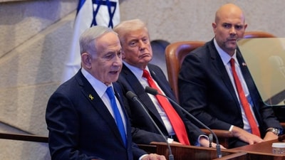 Israeli Prime Minister Benjamin Netanyahu addresses the Knessett, Israel's parliament, as President Donald Trump and Amir Ohana, Speaker of the Israeli Knesset, look on, Monday, Oct. 13, 2025, in Jerusalem. (Chip Somodevilla/Pool via AP) (AP) Israeli Prime Minister Benjamin Netanyahu addresses the Knessett, Israel's parliament, as President Donald Trump and Amir Ohana, Speaker of the Israeli Knesset, look on, Monday, Oct. 13, 2025, in Jerusalem. (Chip Somodevilla/Pool via AP) (AP)