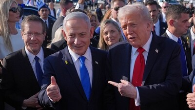 President Donald Trump poses for a photo with Israel's Prime Minister Benjamin Netanyahu before he boards Air Force One at Ben Gurion International Airport, Monday, Oct. 13, 2025, near Tel Aviv, as Israel's President Isaac Herzog watches at left. (AP Photo/Evan Vucci) (AP) President Donald Trump poses for a photo with Israel's Prime Minister Benjamin Netanyahu before he boards Air Force One at Ben Gurion International Airport, Monday, Oct. 13, 2025, near Tel Aviv, as Israel's President Isaac Herzog watches at left. (AP Photo/Evan Vucci) (AP)