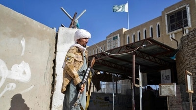 An Armed Taliban security personnel keeps guard beside the closed gate of the zero point border crossing between Afghanistan and Pakistan at Spin Boldak district in Kandahar (AFP) An Armed Taliban security personnel keeps guard beside the closed gate of the zero point border crossing between Afghanistan and Pakistan at Spin Boldak district in Kandahar (AFP)