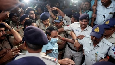 Sresan Pharma owner S Ranganathan is escorted by police to a local court (REUTERS)