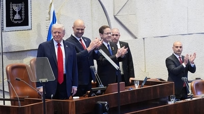 President Donald Trump arrives with Knesset Speaker Amir Ohana and Israel's President Isaac Herzog to speak to the Knesset, Israel's parliament, Monday, Oct. 13, 2025, in Jerusalem. (AP) President Donald Trump arrives with Knesset Speaker Amir Ohana and Israel's President Isaac Herzog to speak to the Knesset, Israel's parliament, Monday, Oct. 13, 2025, in Jerusalem. (AP)