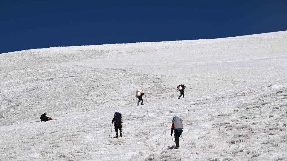 This picture shows members of the expedition “Pamir-Ice-Memory” climbing up Pamir Glacier, on September 25 in Kon Chukurbashi, eastern Tajikistan. (AFP)