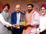 (From left) Global Punjabi Association chief patron and author of ‘Tilak Janju Ka Rakha’ Iqbal Singh Lalpura, association president Kulwant Singh Dhaliwal, Haryana CM Nayab Singh Saini and former Punjab Agricultural University VC Kirpal Singh Aulakh at Tagore Theatre, Sector 18, Chandigarh, on Monday. (Keshav Singh/HT)